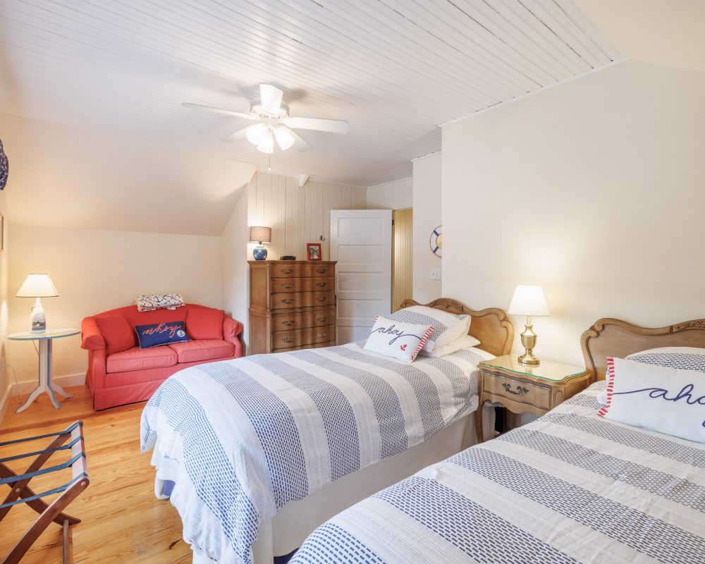 Water's Edge bedroom with two twin beds and pull out sofa.